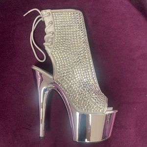 Dance, stripper heel. Silver/Chrome sizes 7 and 8 available. New by Pleaser